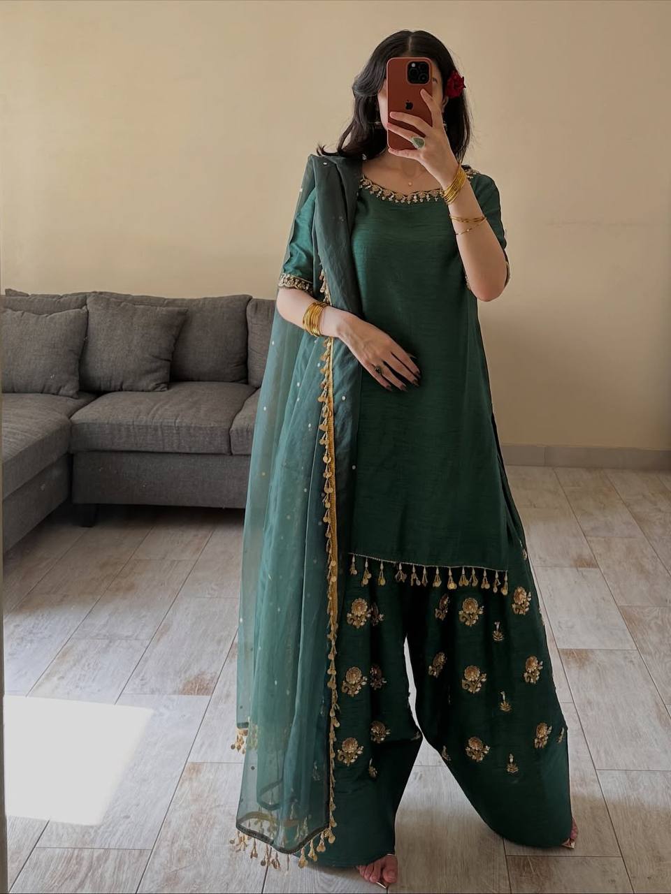 Majestic Emerald Green Kurta and Salwar Suit Set Featuring Intricate Gold Embroidery, Floral Motifs, and Ornate Coin Tassel Embellishments